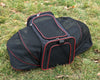 Caisse pour transport de chienextensible, coloris noir liseré rouge